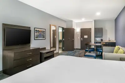 a living room with a television and a living room at Comfort Inn & Suites Adrian in Adrian