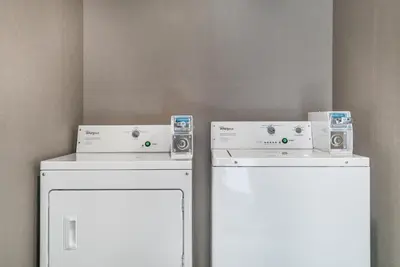 two white refrigerators with speakers on top of them at Comfort Inn & Suites Adrian in Adrian