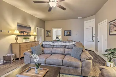 a living room with a couch and a ceiling fan at Quaint Apartment in Historic Georgetown! in Georgetown