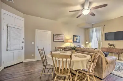 a living room with a table and a couch at Quaint Apartment in Historic Georgetown! in Georgetown
