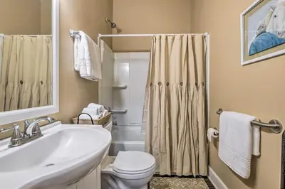 a bathroom with a sink and a toilet and a shower at Quaint Apartment in Historic Georgetown! in Georgetown