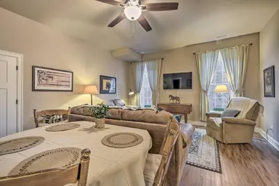 a living room with a table and a couch at Quaint Apartment in Historic Georgetown! in Georgetown