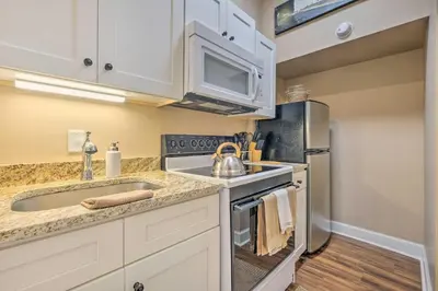 a kitchen with a sink and a stove at Quaint Apartment in Historic Georgetown! in Georgetown