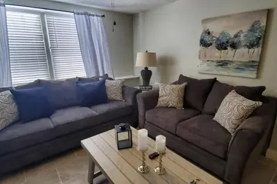 a living room with two couches and a coffee table at Lacinda's Cozy Home in Beckett Ridge