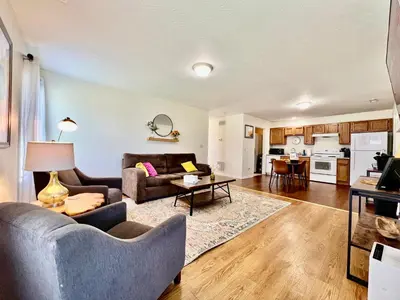 a living room with a couch and a table at Lennie's House Near the Lake in Monroe