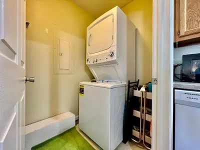 a small kitchen with a white refrigerator and a microwave at Lennie's House Near the Lake in Monroe
