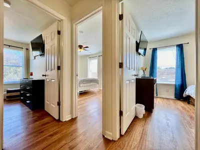 an empty room with two doors and a bedroom at Lennie's House Near the Lake in Monroe