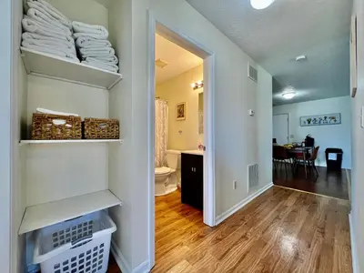 a hallway with a room with a bathroom and a kitchen at Lennie's House Near the Lake in Monroe