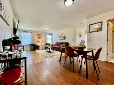 a living room with a table and a couch at Lennie's House Near the Lake in Monroe