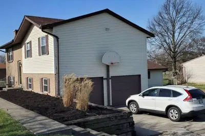 a white car parked in front of a house at Pet Friendly Home with Fenced in Yard in Bethany