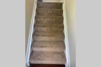 a staircase in a house with a carpet at Pet Friendly Home with Fenced in Yard in Bethany
