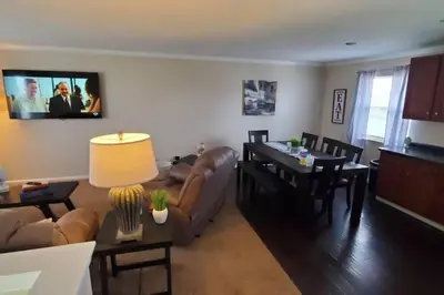 a living room with a couch and a table at Pet Friendly Home with Fenced in Yard in Bethany