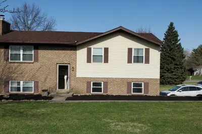 a house with a car parked in front of it at Pet Friendly Home with Fenced in Yard in Bethany