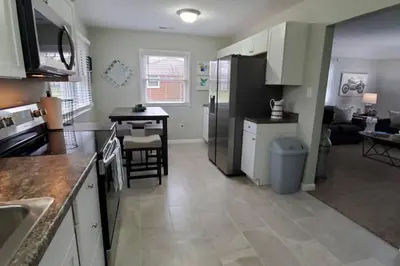 a kitchen and living room with a table and a counter at West Chester Mason Home Near Kings Island in Pisgah
