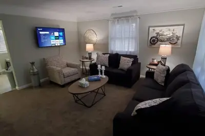 a living room with a couch and a table at West Chester Mason Home Near Kings Island in Pisgah