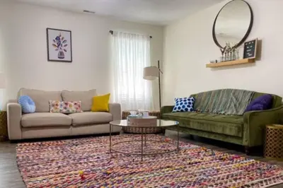 a living room with a couch and a table at Bailee's House in Monroe in Monroe