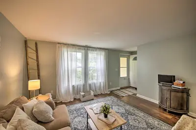 a living room with a couch and a tv at Cozy Home on 17 Acres, 3 Miles to Downtown! in Fort Wayne