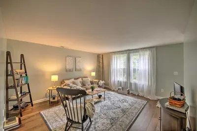 a living room with a couch and a table at Cozy Home on 17 Acres, 3 Miles to Downtown! in Fort Wayne