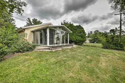 a small house in a field with a yard at Cozy Home on 17 Acres, 3 Miles to Downtown! in Fort Wayne