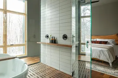 a bathroom with a shower and a bed and a tub at Idyll Reserve - Hocking Hills in South Bloomingville
