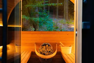 a porch with two baskets and a window at Idyll Reserve - Hocking Hills in South Bloomingville