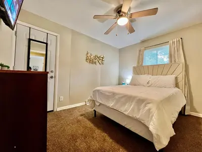 a bedroom with a bed and a ceiling fan at Nice Place for the Budget Conscious in Middletown