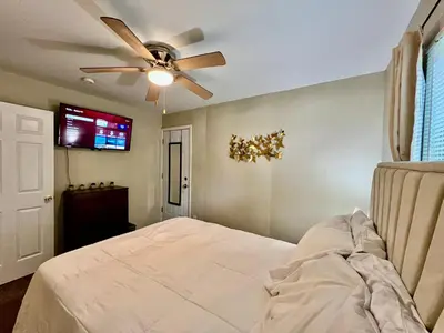 a bedroom with a bed and a ceiling fan at Nice Place for the Budget Conscious in Middletown
