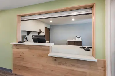 an office with a large window and a desk at WoodSpring Suites Dayton North in Dayton