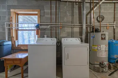 two refrigerators in a room with at Creekwood Chalet - Hocking Hills with Hot Tub and Near Hiking in South Bloomingville