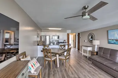 a kitchen and living room with a table and a couch at Middle Bass Condo with Balcony, Lake Erie Views in Put-in-Bay