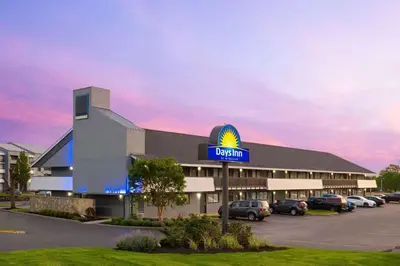 a hotel with a sign on the front of it at Days Inn by Wyndham Columbus Worthington in Columbus