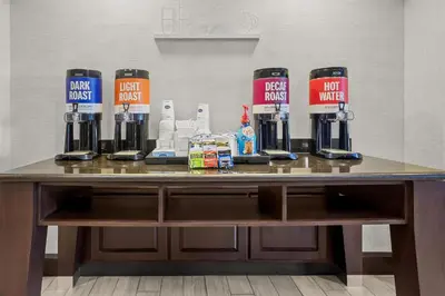 a table with a coffee machine on top of it at Hampton Inn Middletown in Middletown