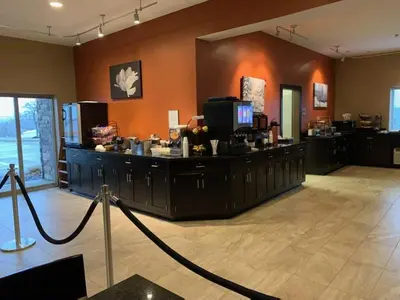 a large room with a counter in a room at Berlin Grande Hotel in Berlin