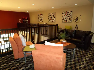 a living room with a couch and chairs and tables at Berlin Grande Hotel in Berlin
