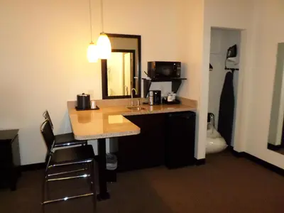 a hotel room with a sink and a mirror at Berlin Grande Hotel in Berlin