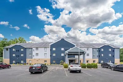 a large building with cars parked in a parking lot at Country Inn & Suites by Radisson, Pickerington, OH in Pickerington