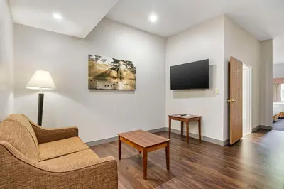 a living room with a couch and a tv at Country Inn & Suites by Radisson, Pickerington, OH in Pickerington