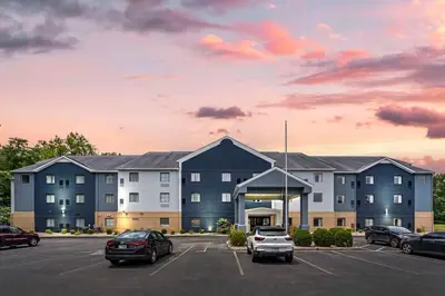 a large building with cars parked in a parking lot at Country Inn & Suites by Radisson, Pickerington, OH in Pickerington