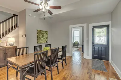 a dining room with a table and chairs and a ceiling fan at Recently Renovated Home in the Heart of Bellevue! home in Bellevue