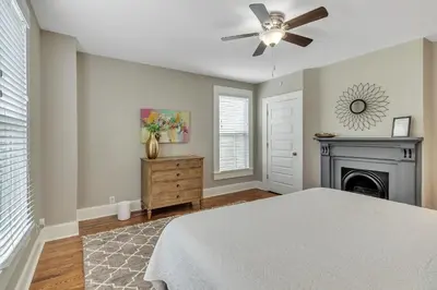 a bedroom with a bed and a fireplace at Recently Renovated Home in the Heart of Bellevue! home in Bellevue