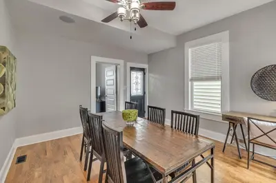 a dining room with a wooden table and chairs at Recently Renovated Home in the Heart of Bellevue! home in Bellevue