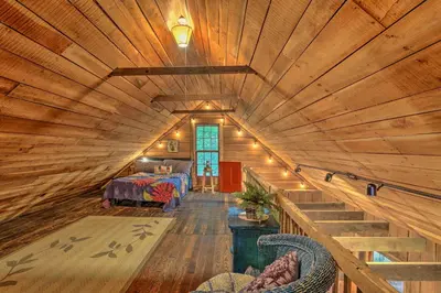 a room with a large wooden ceiling in a house at Rustic Cabin in the Woods 2-Acre Fishing Pond! in Burlington