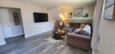 a living room with a couch and a tv at A great newly renovated place to stay in Franklin in Franklin