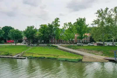 a park next to a body of water at Riverfront Studio with Private Patio and Garden! in Augusta