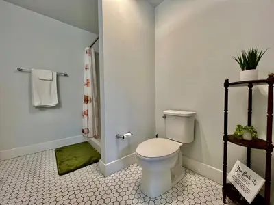 a bathroom with a toilet and a shower at New renovated Loft in Old factory by Kings Island in Maineville