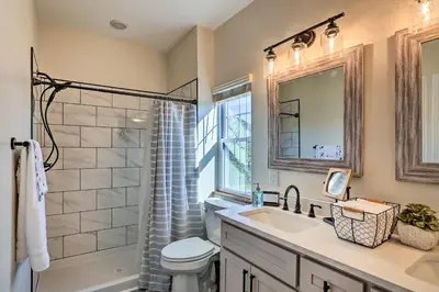 a bathroom with a sink and a shower and a toilet at Chic Williamstown Retreat with Pool and Hot Tub! in Williamstown