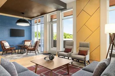 a living room with a couch and chairs and a table at Hyatt Place Columbus Polaris in Columbus