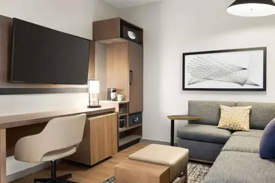 a living room with a couch and a chair at Hyatt Place Columbus Polaris in Columbus