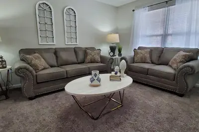 a living room with a couch and a table at Diamond in the Rough-696 in Middletown