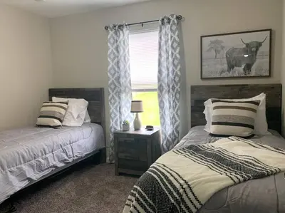 a bedroom with two beds and a window at Diamond in the Rough-696 in Middletown